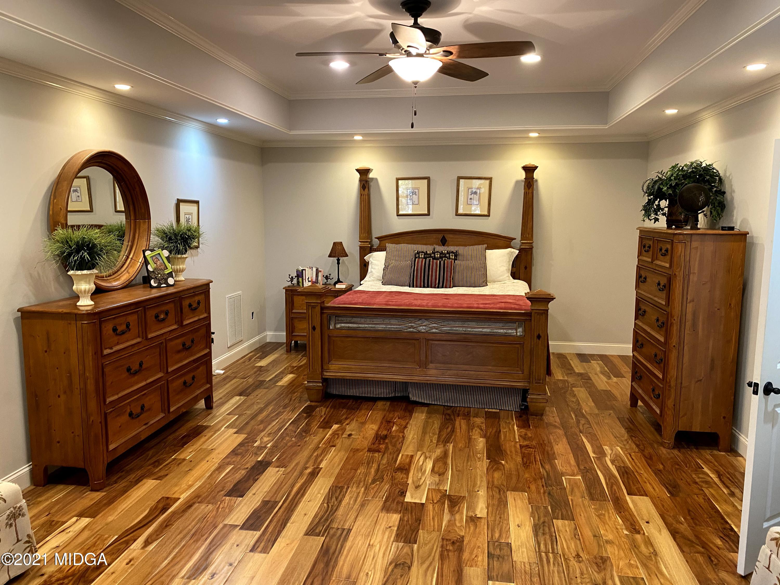 619 Harper Road Perry, GA 31069 - Photo 20 of 27 a bed room with a bed and a dresser