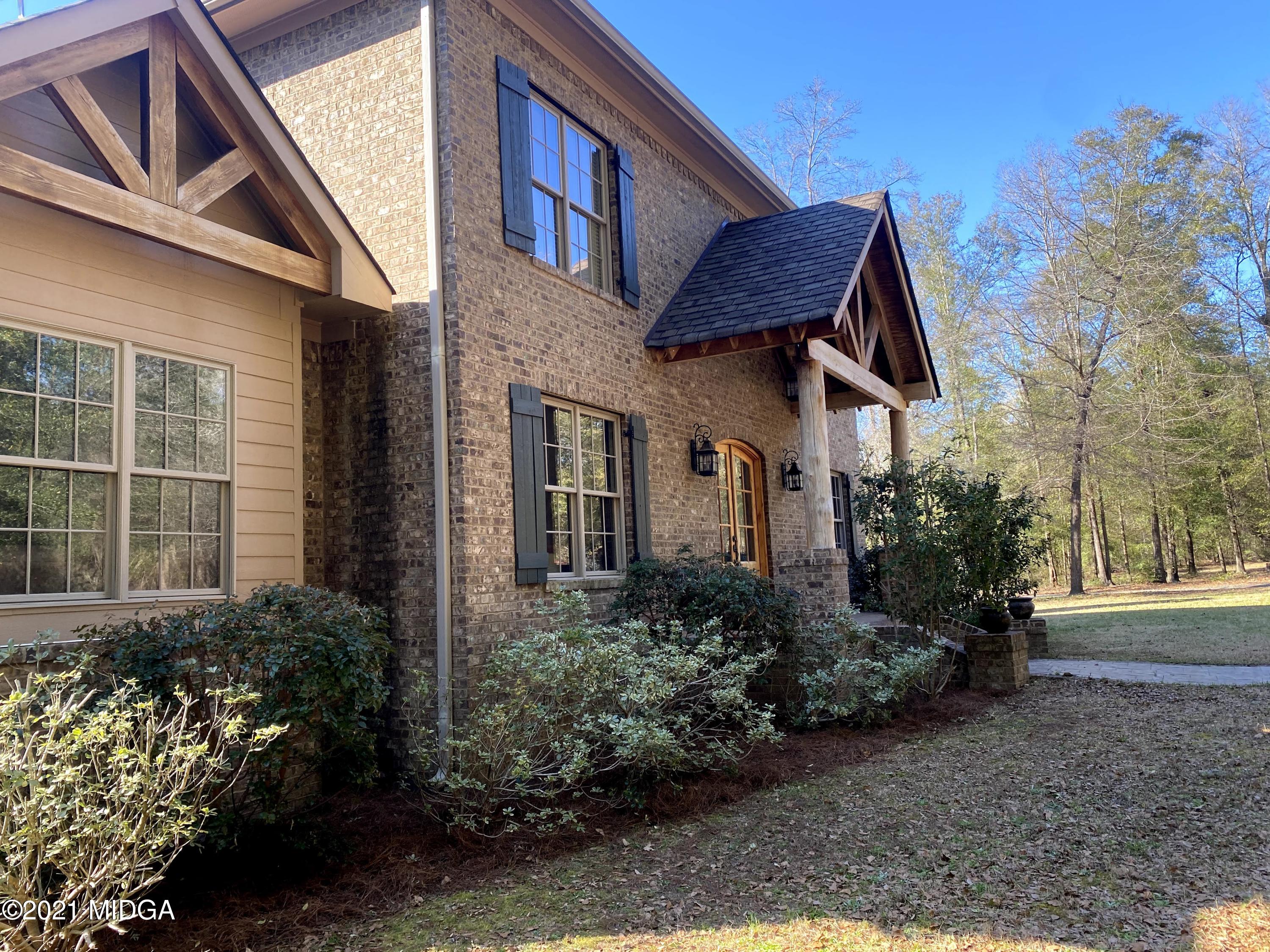 619 Harper Road Perry, GA 31069 - Photo 3 of 27 a front view of a house with garden