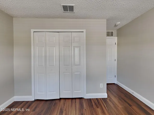 a view of room with hardwood floor