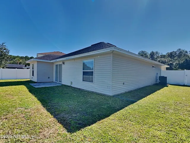 a view of a backyard with a garden