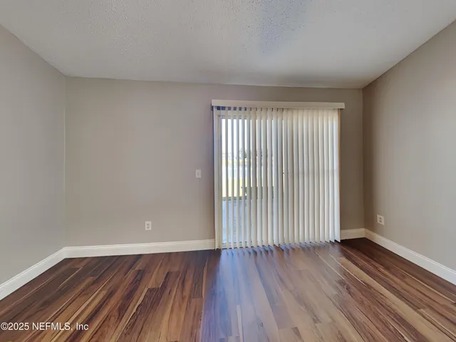 a view of a room that has wooden floor in it