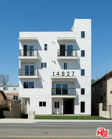 a view of a white building among the street