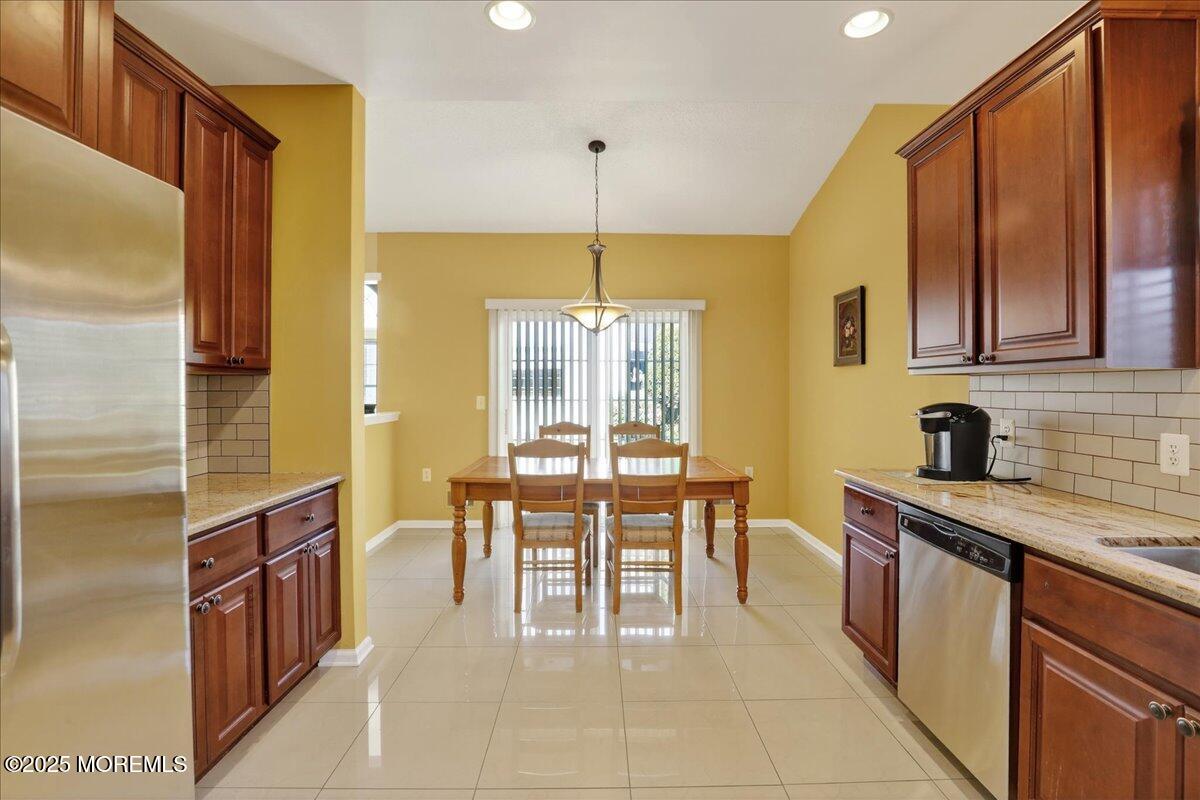 53 Pine Valley Road Jackson, NJ 08527 - Photo 18 of 51 a dining table chairs sink and cabinets