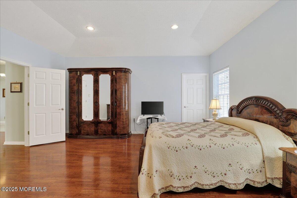 53 Pine Valley Road Jackson, NJ 08527 - Photo 26 of 51 a bedroom with a bed and wooden floor