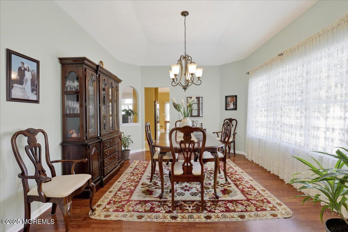 53 Pine Valley Road Jackson, NJ 08527 - Photo 8 of 51 a view of a dining room with furniture and a chandelier
