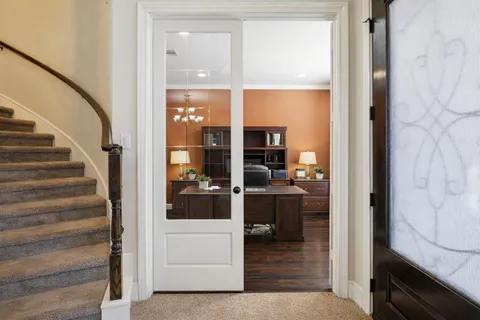 a view of entryway and hall with wooden floor