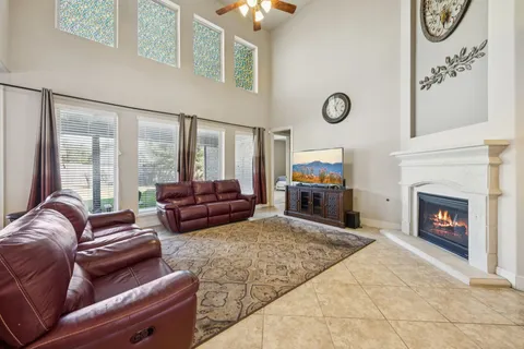 a living room with furniture fireplace and flat screen tv
