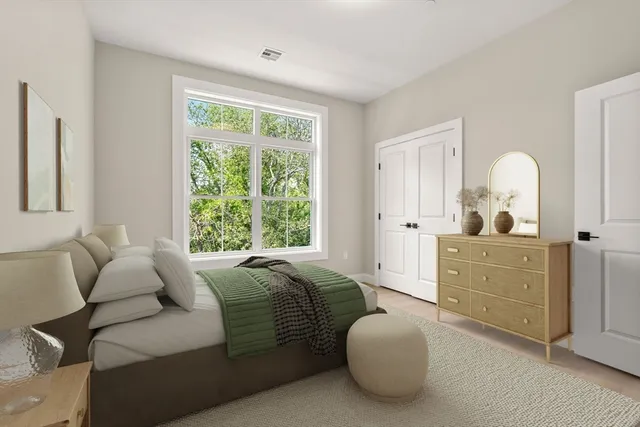 a bed room with a bed and a dresser