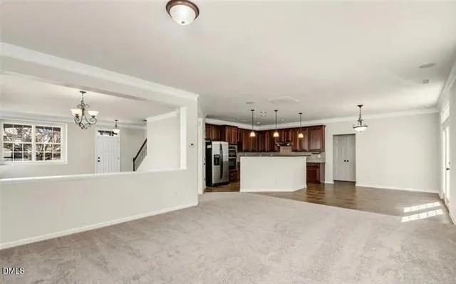 a view of a kitchen with a sink and cabinets
