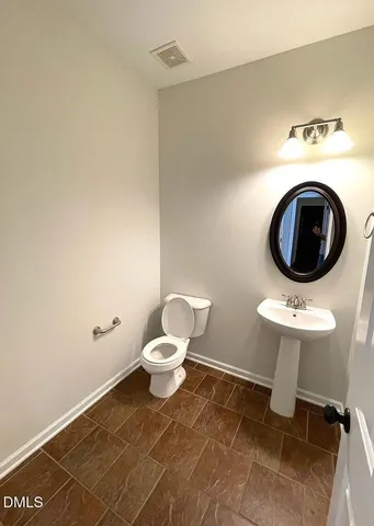 a bathroom with a toilet and a sink