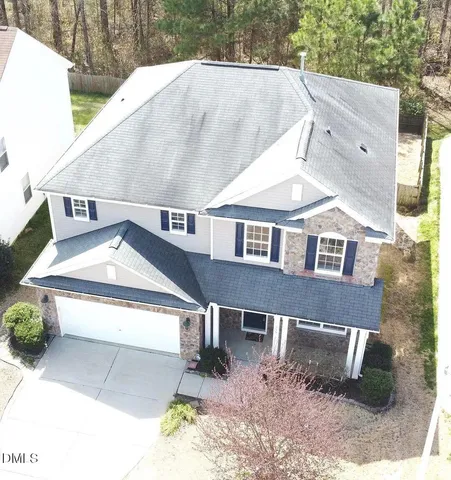 a aerial view of a house with a yard
