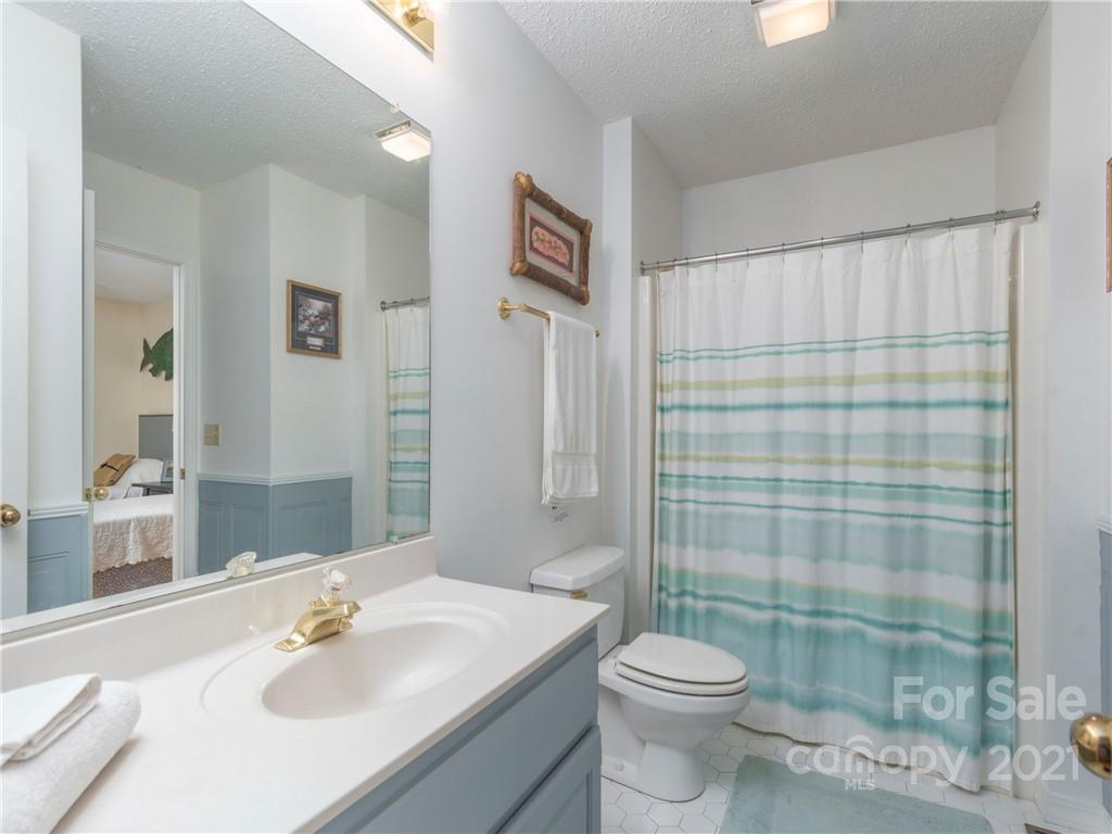 51 Forest Road Canton, NC 28716 - Photo 13 of 26 a bathroom with a sink toilet and shower