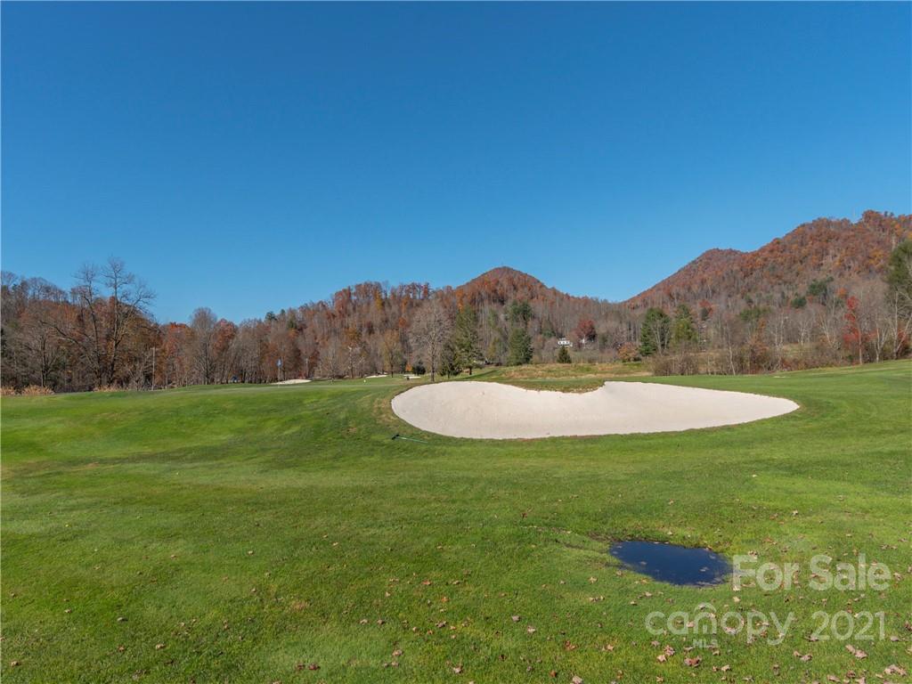 51 Forest Road Canton, NC 28716 - Photo 19 of 26 a view of a swimming pool with a yard