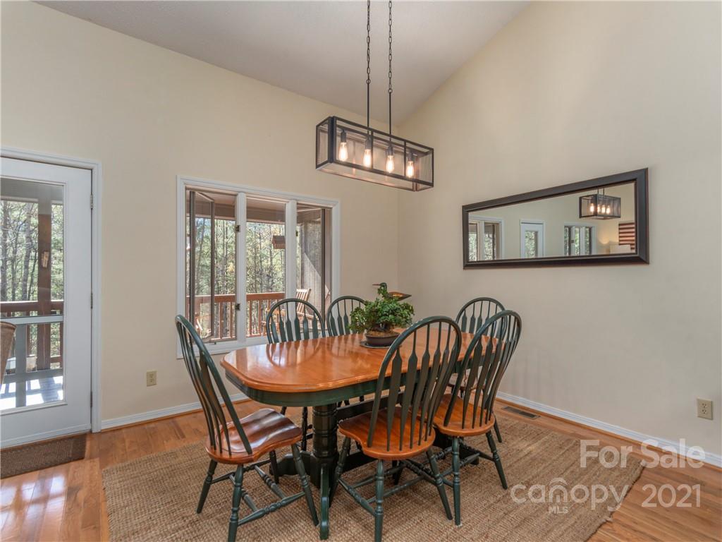 51 Forest Road Canton, NC 28716 - Photo 4 of 26 a view of a dining room with furniture wooden floor and a chandelier