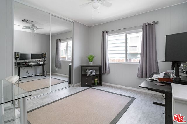 a bedroom with furniture and a window