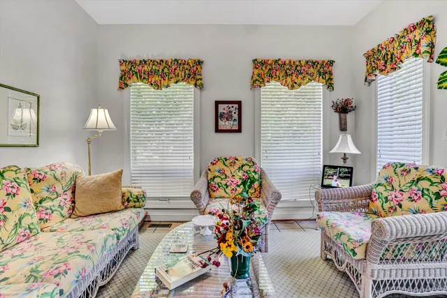 a bedroom with furniture and a lamp