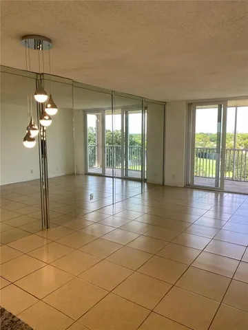 a bathroom with a sink a toilet a mirror and shower