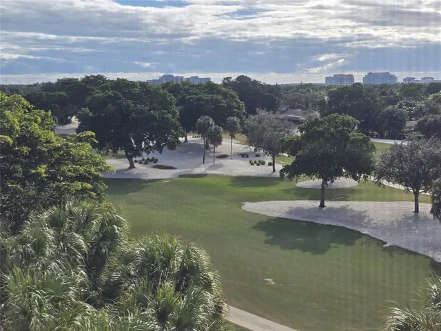 a view of a lake with a yard