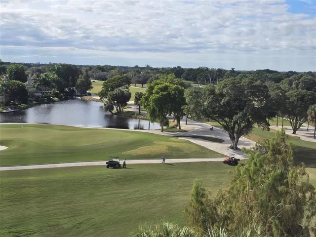 an aerial view of a house with a lake view
