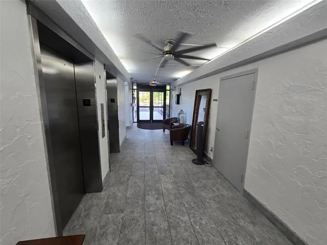 a view of a livingroom with furniture and windows