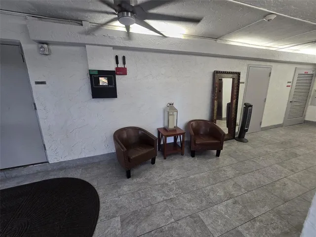 a view of a hallway with workspace