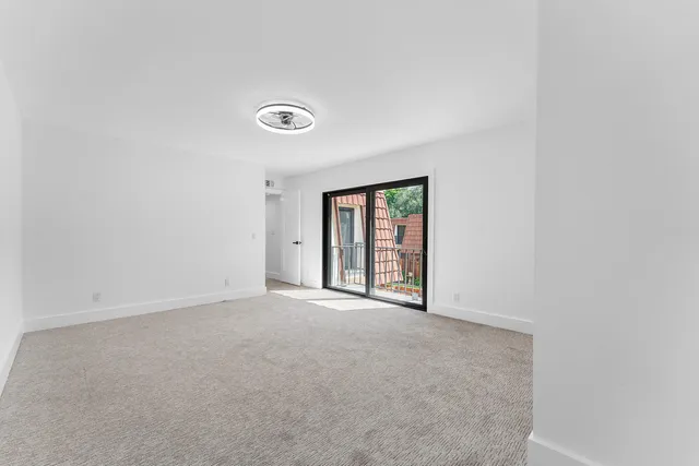 a view of a small yard from a balcony