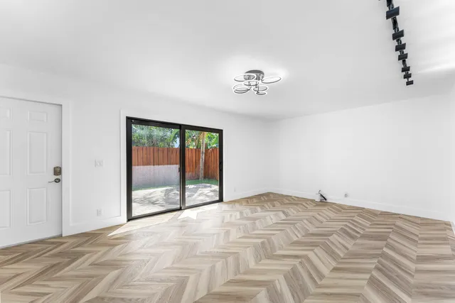 a view of an empty room with a window