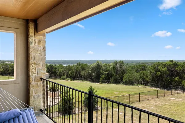 a view of a balcony with an outdoor space