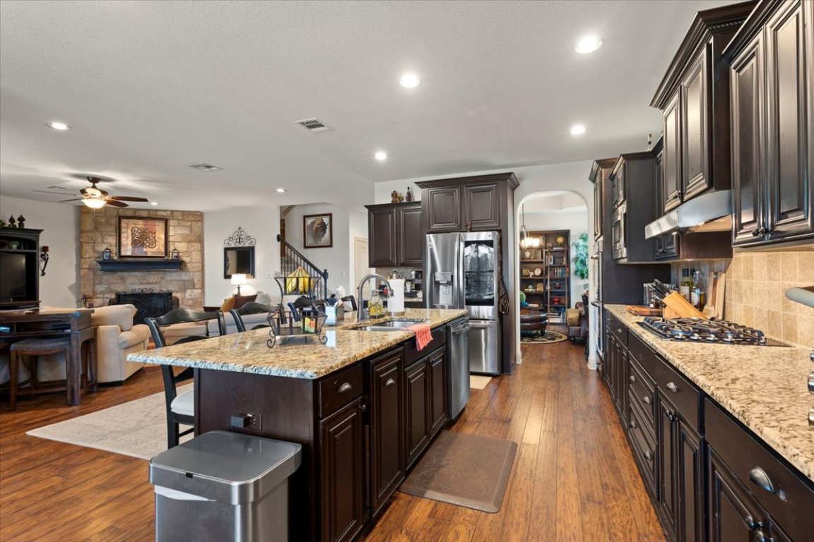 224 Whitney Woods Circle Georgetown, TX 78633 - Photo 13 of 40 a large kitchen with stainless steel appliances lots of counter space