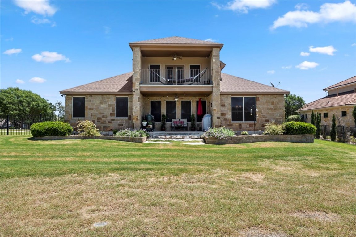 224 Whitney Woods Circle Georgetown, TX 78633 - Photo 36 of 40 a front view of a house with garden and porch