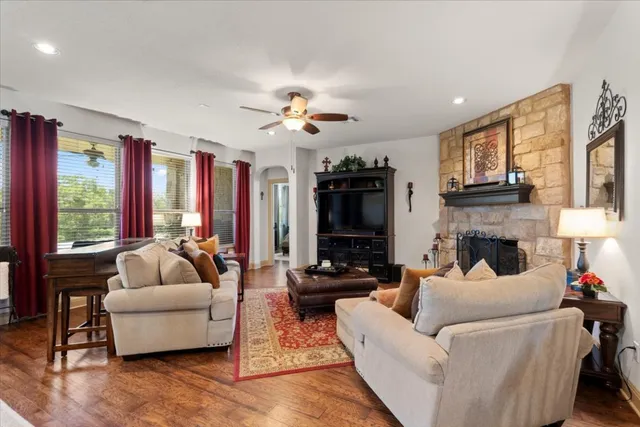 a living room with furniture fireplace and flat screen tv