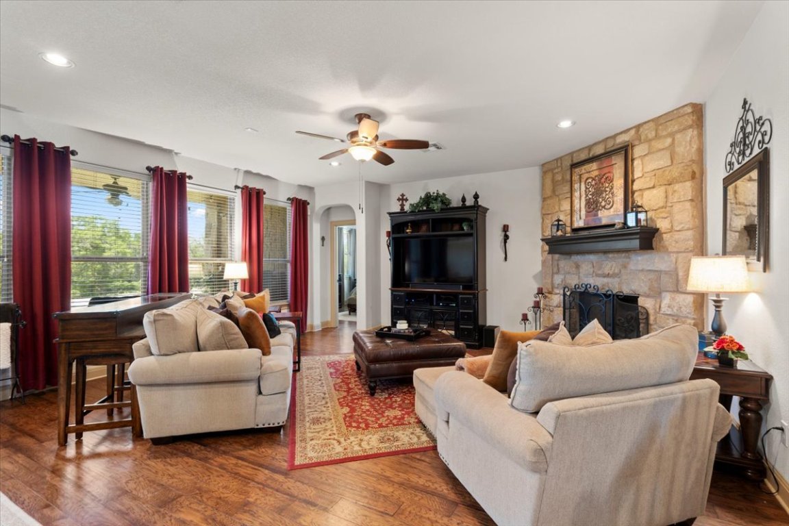 224 Whitney Woods Circle Georgetown, TX 78633 - Photo 8 of 40 a living room with furniture fireplace and flat screen tv