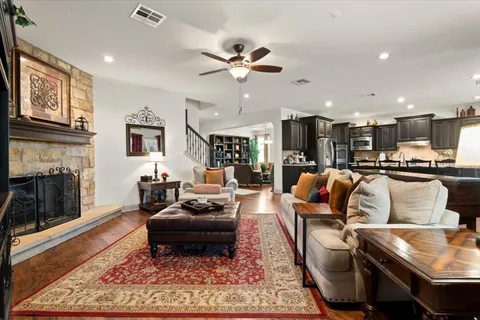 a living room with furniture and kitchen view