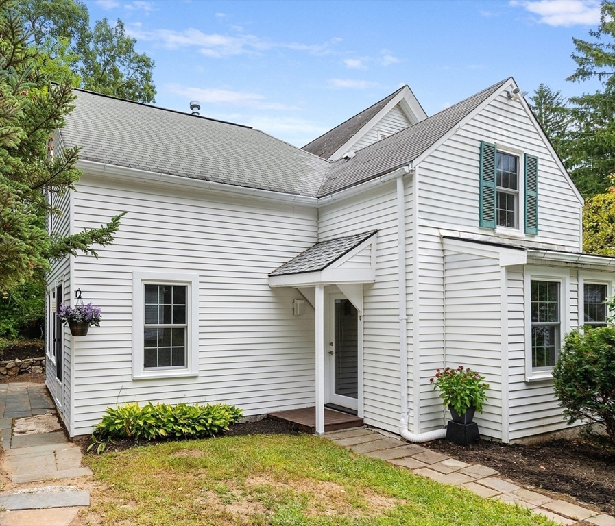 148 Wood Street, Unit 4 Lexington, MA 02421 - Photo 1 of 26 a front view of a house with potted plants