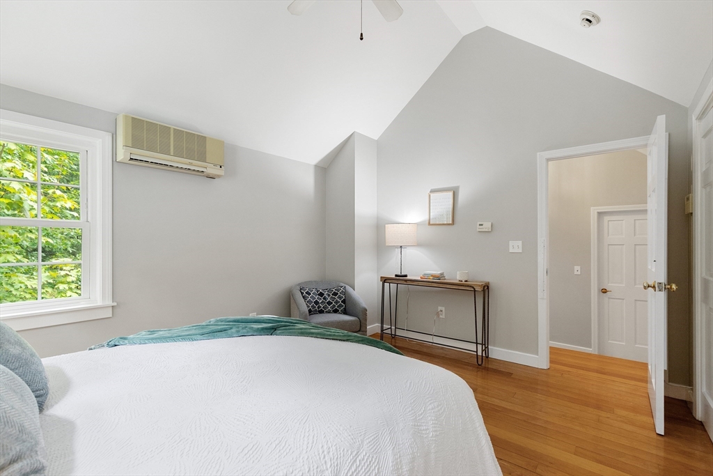 148 Wood Street, Unit 4 Lexington, MA 02421 - Photo 15 of 26 a bedroom with a bed and a dresser