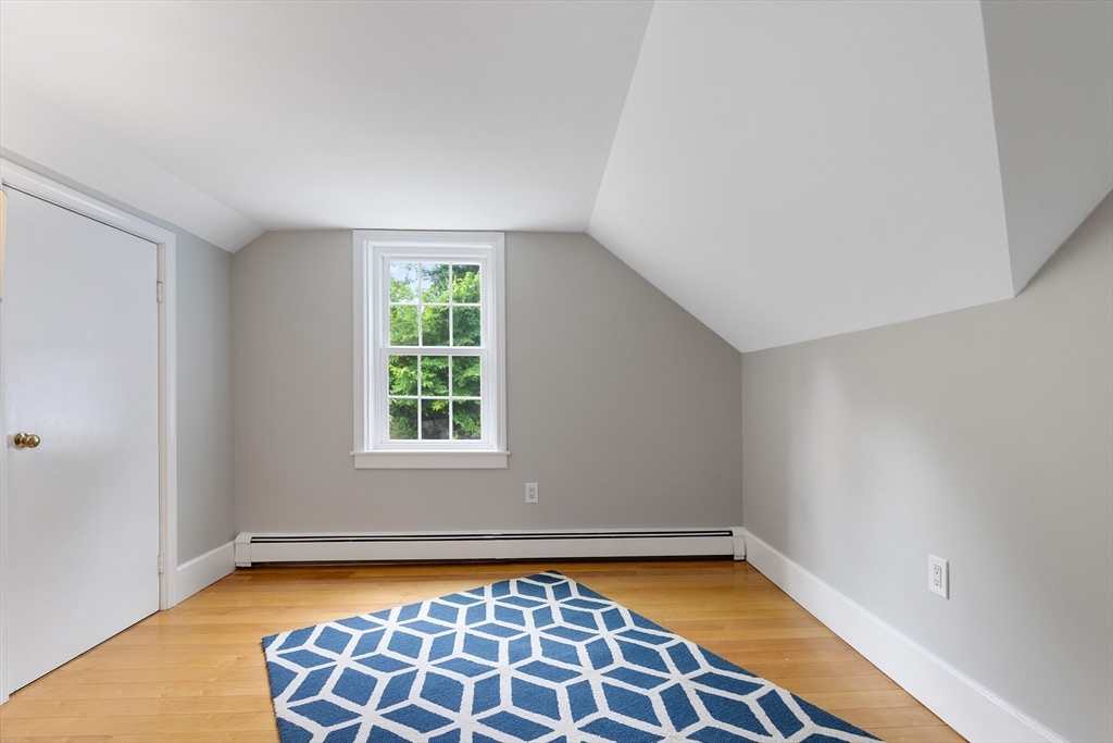 148 Wood Street, Unit 4 Lexington, MA 02421 - Photo 16 of 26 a view of a room with window and wooden floor