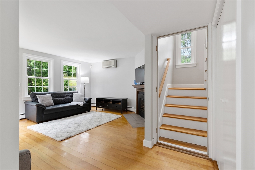 148 Wood Street, Unit 4 Lexington, MA 02421 - Photo 6 of 26 a living room with furniture and a large window
