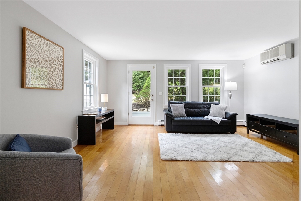 148 Wood Street, Unit 4 Lexington, MA 02421 - Photo 8 of 26 a living room with furniture window and a couch