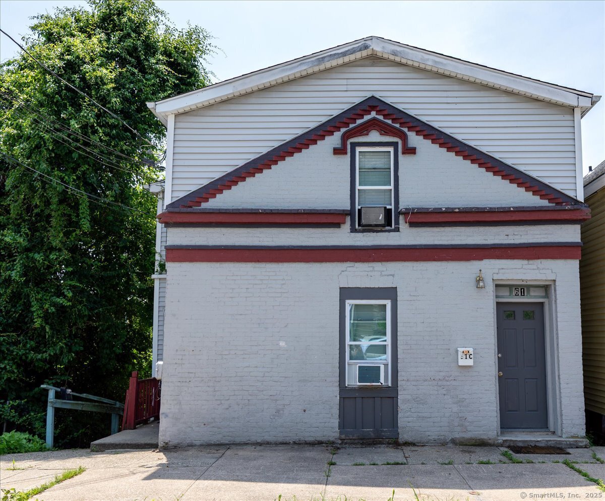61 School Street Norwich, CT 06360 - Photo 1 of 1 a front view of a house with parking