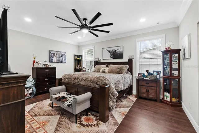 a bedroom with a bed a couch and dresser