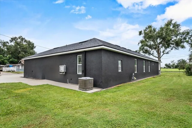 a backyard of a house with lots of green space