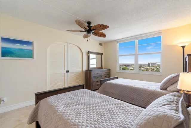 a bedroom with double bed and a window