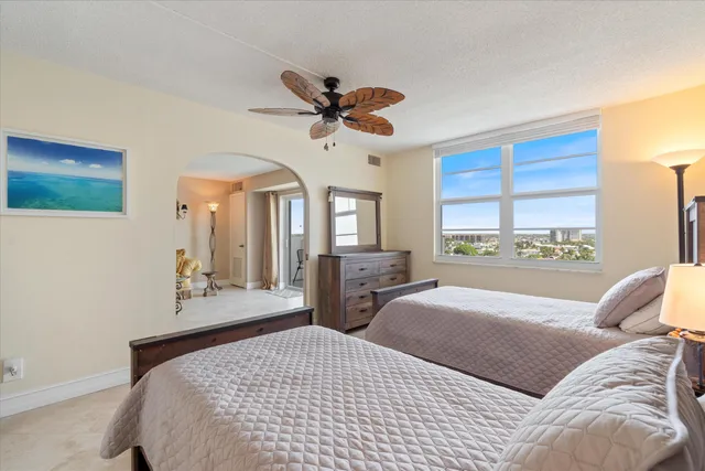 a bedroom with a large bed and a window