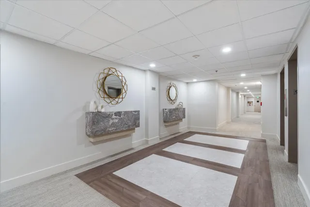 a view of an entryway with wooden floor