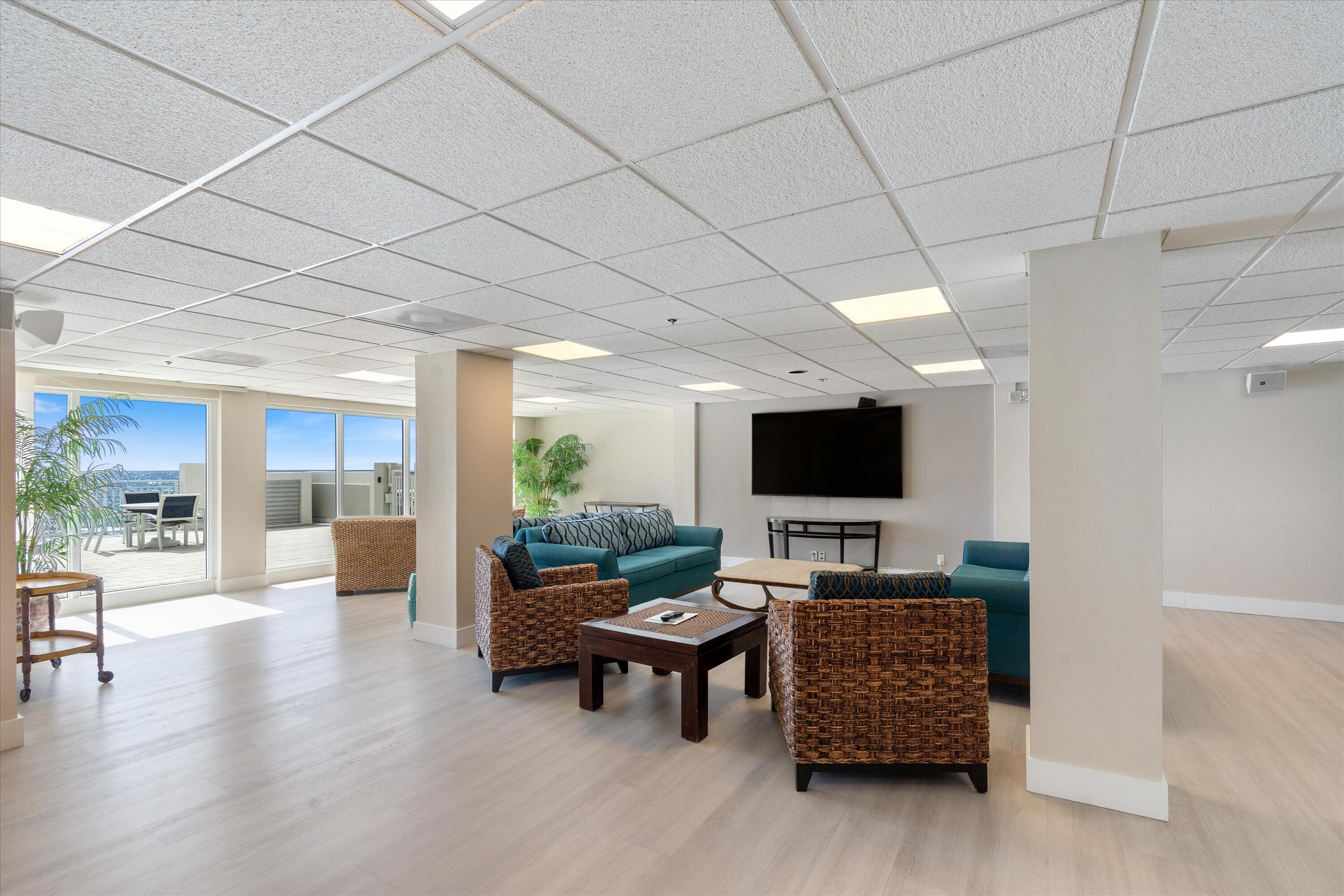 4505 South Ocean Boulevard, Unit 904 Highland Beach, FL 33487 - Photo 34 of 39 a living room with furniture and a flat screen tv