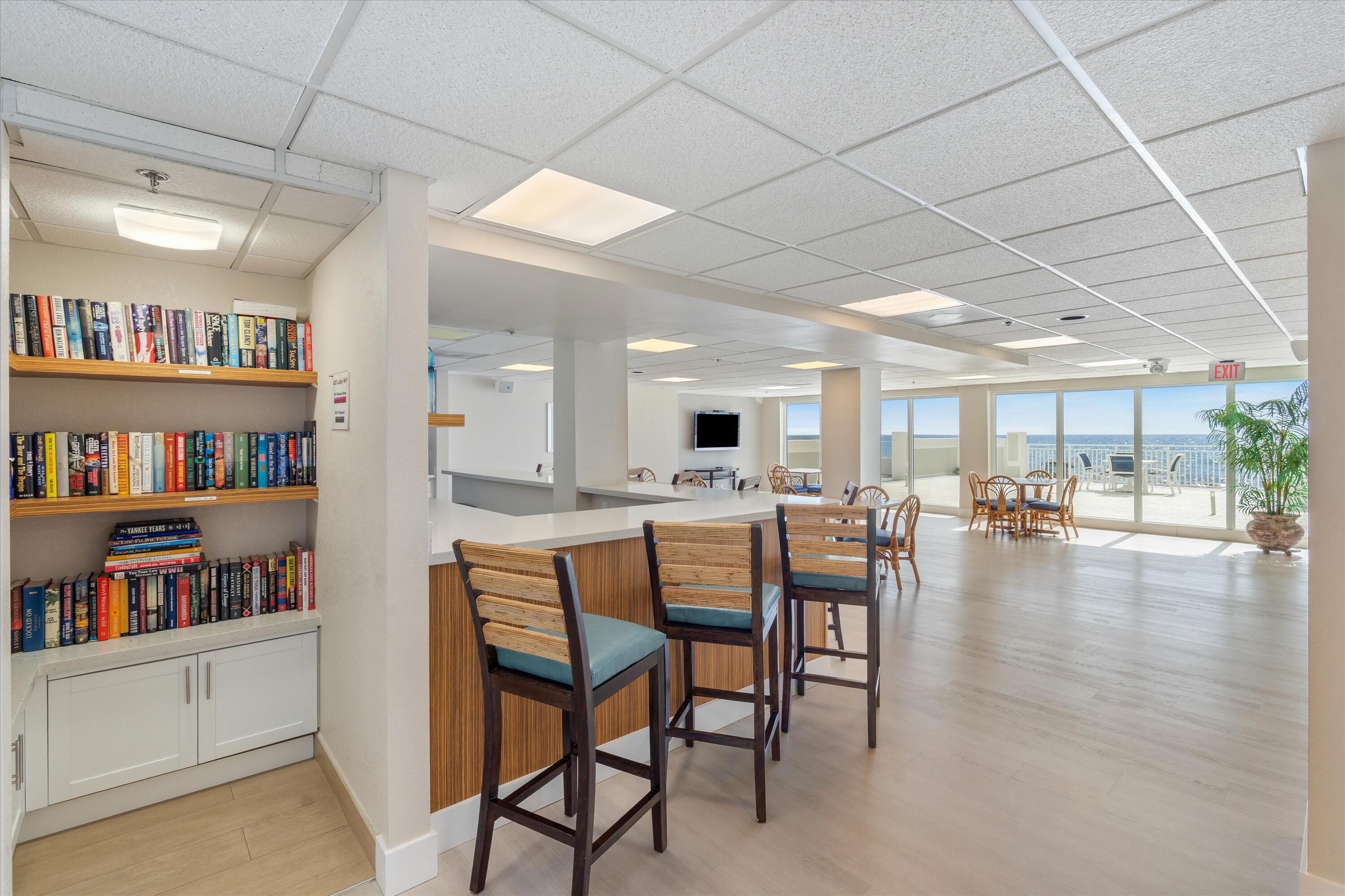4505 South Ocean Boulevard, Unit 904 Highland Beach, FL 33487 - Photo 36 of 39 a dining room with furniture and a book shelf