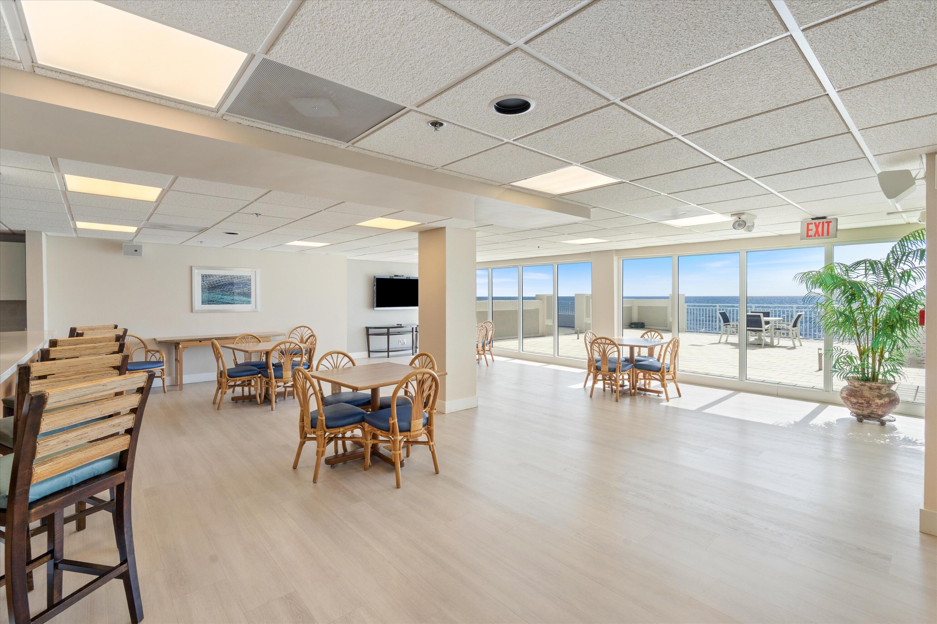 4505 South Ocean Boulevard, Unit 904 Highland Beach, FL 33487 - Photo 37 of 39 a living room with furniture and kitchen view with wooden floor