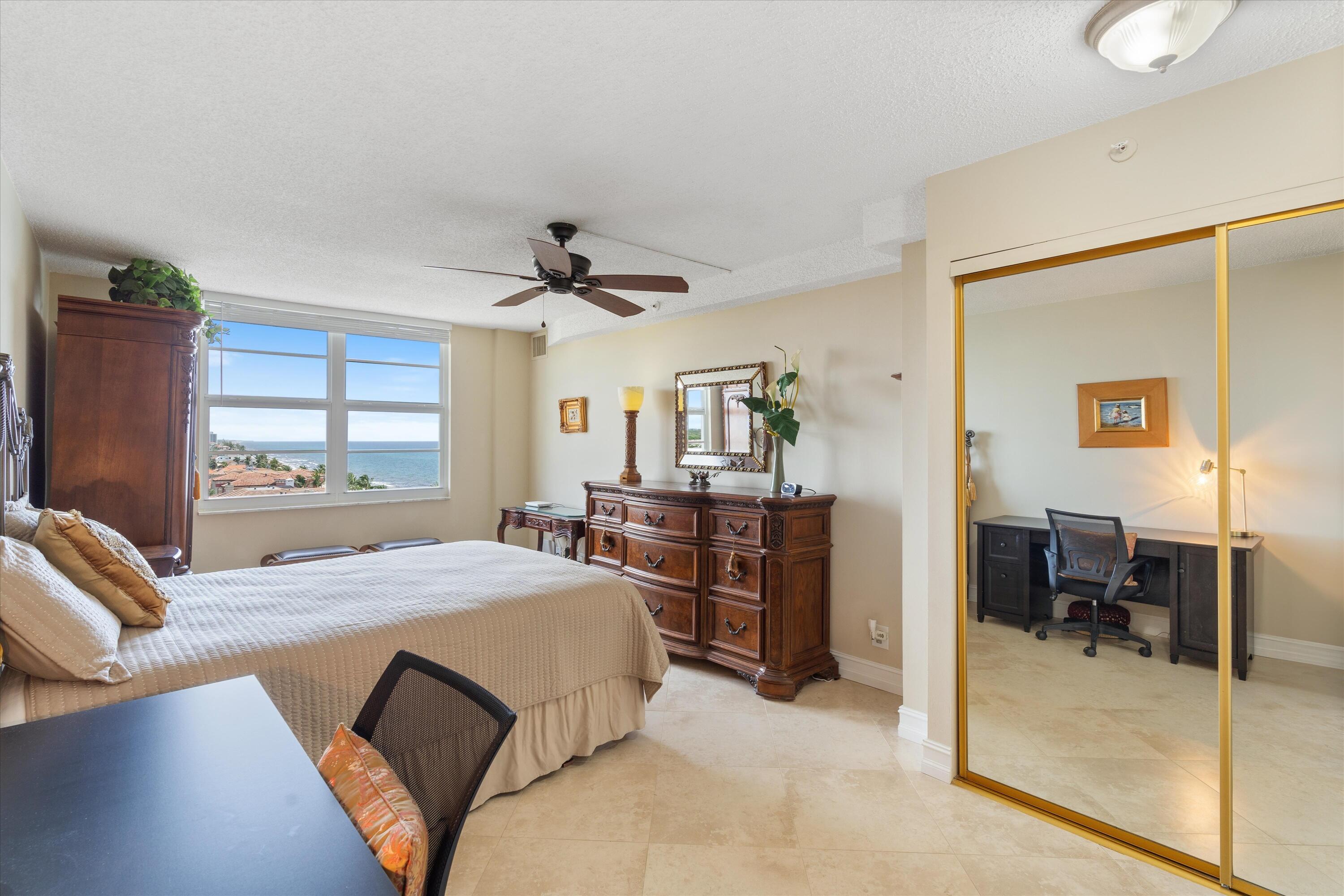 4505 South Ocean Boulevard, Unit 904 Highland Beach, FL 33487 - Photo 8 of 39 a bedroom with a bed and a large window