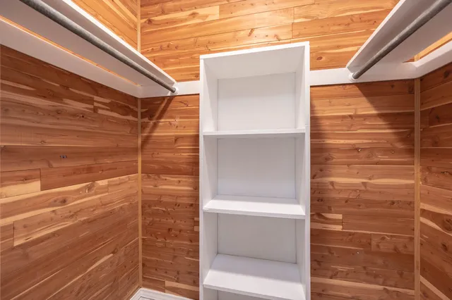 a view of a room with wooden floor and balcony