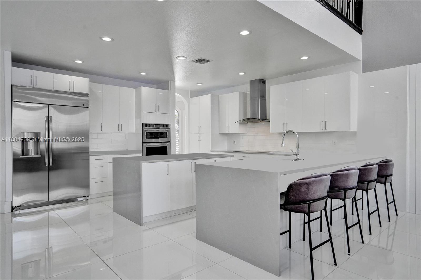 10457 Laurel Road Davie, FL 33328 - Photo 16 of 96 a kitchen with stainless steel appliances granite countertop a stove a sink and a refrigerator